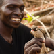 Best buddies. Yassene holds a male greater honeyguide